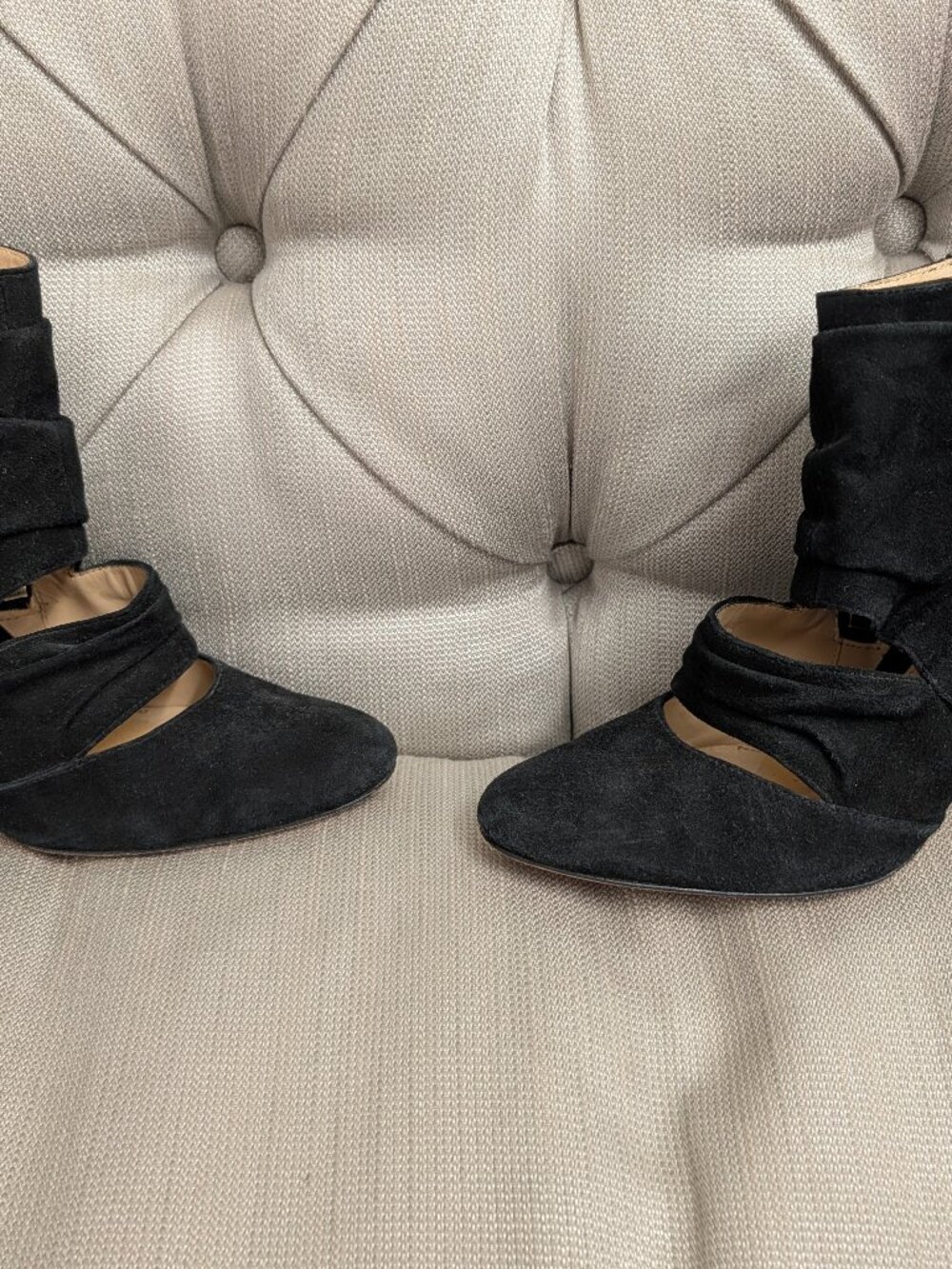 Elegant and feminine black suede ankle boots with high heels